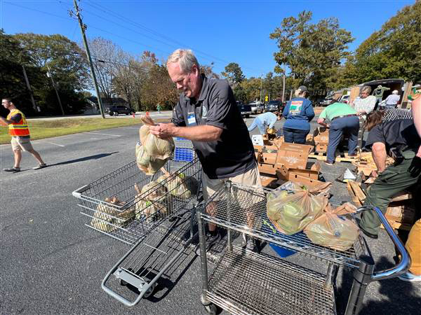 Code Enforcement helps with community food distribution